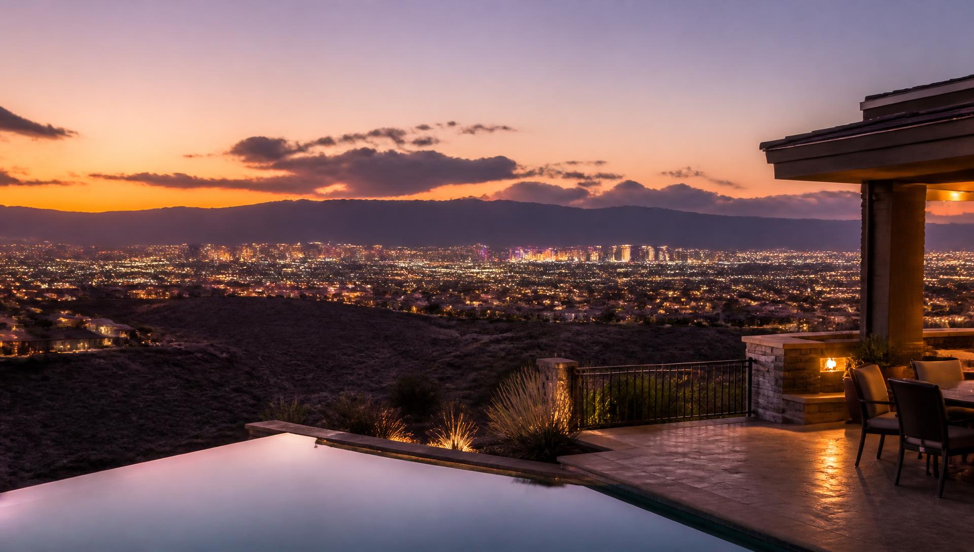 Las Vegas valley skyline at dusk from a hillside home